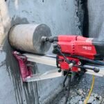 Hilti DD 250 diamond core drill rig coring a concrete wall in Vancouver, BC