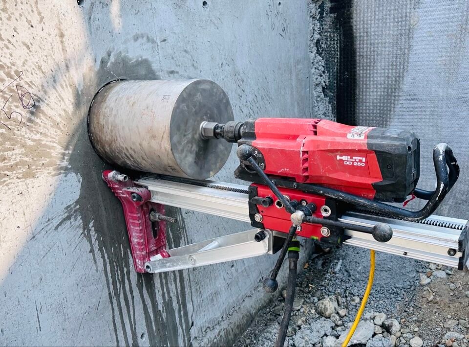 Hilti DD 250 diamond core drill rig coring a concrete wall in Vancouver, BC